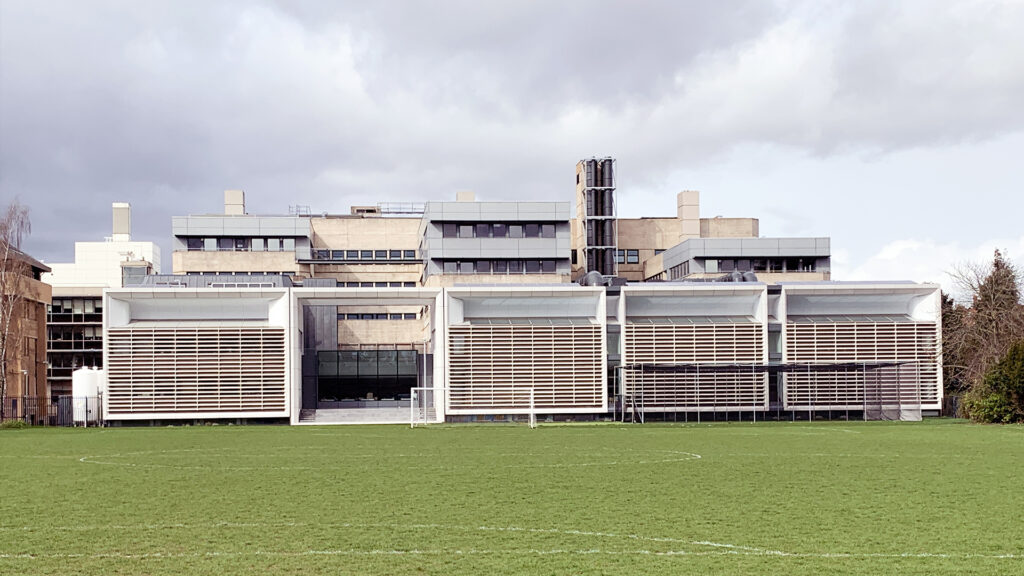The University of Oxford Tinbergen, designed by FJMT - a row of layered technological cubes for research and learning.